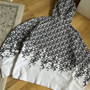 Black and White Striped Sweater with Ribbed Hem